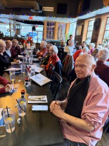 lunch gathering at restaurant with holiday lights