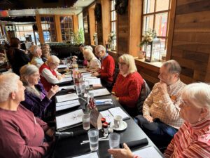 lunch gathering at restaurant with holiday lights