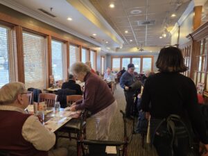 section of a restaurant filling up with patrons