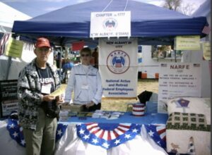Two members at the Lanesville Festival giving out Narfe membership information to federal employees & retirees as they talk to people attending the festival.