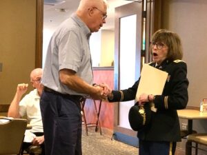 Chapter 1927 Vice President Mike Madges welcomes speaker Dr. Kathy Platoni (Colonel U.S. Army retired)