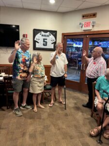 Three chapter officers on left and Florida Federation President on right during swearing in ceremony