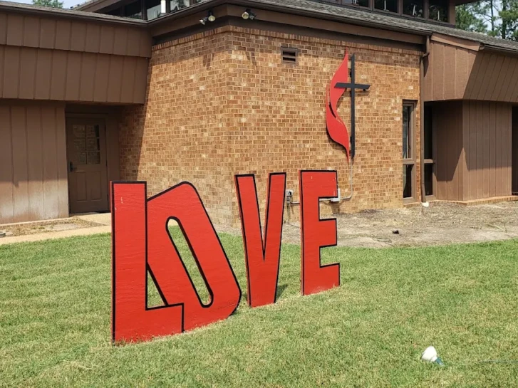 Brick Church with the letter spelling LOVE in front