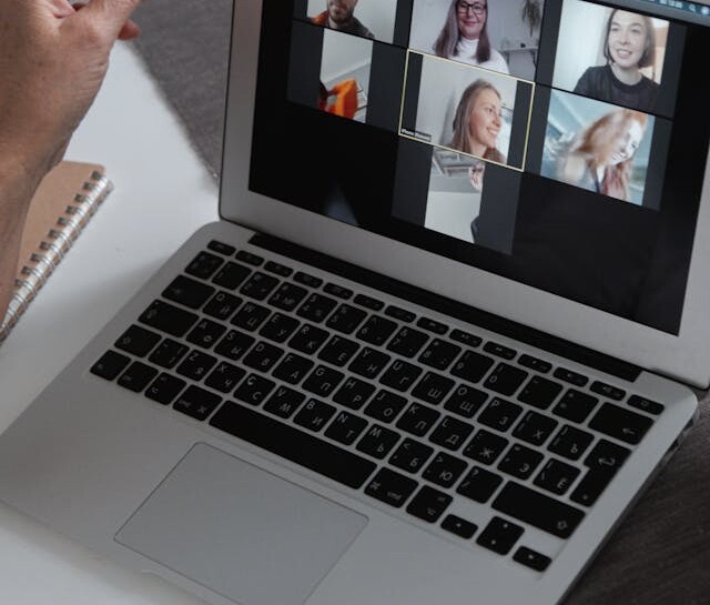 laptop with video conference on screen