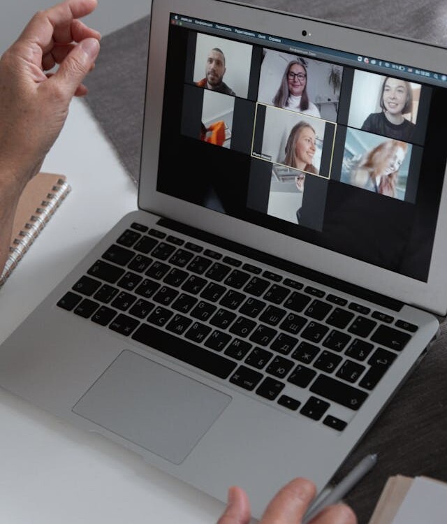laptop with video conference on screen