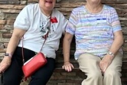 Picture of two women sitting on a bench