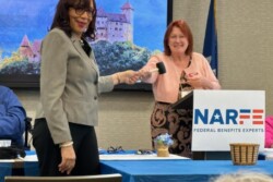 Picture of Host Chapter President turning over the gavel to LA President