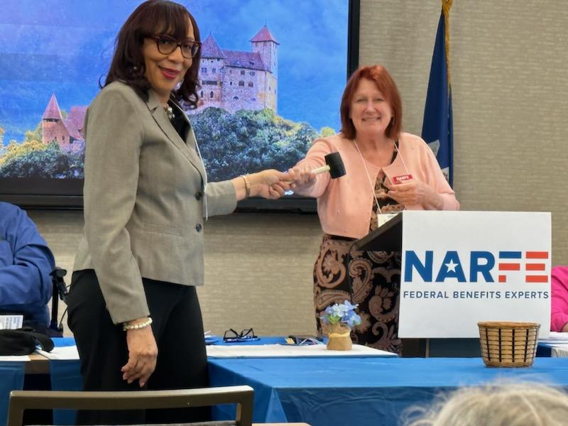 Picture of Host Chapter President turning over the gavel to LA President