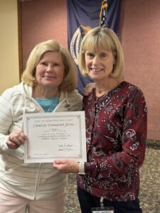 Two women holding Alzheimer certificate presented to Chapter for Walk to End Alzheimer