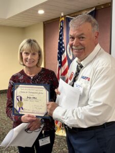 Federation President presenting Award to Alzheimer Chair from Region 04 Alzheimer chair