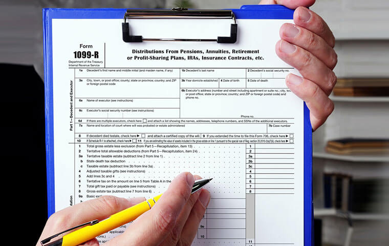 1099-R form on a clipboard