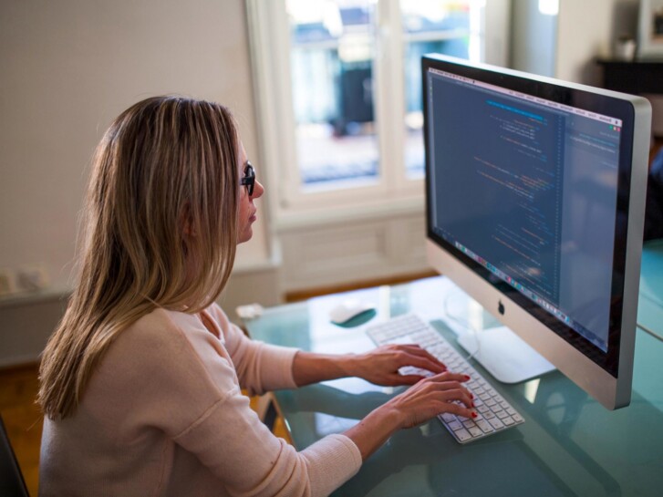 Person sitting at a desktop computer