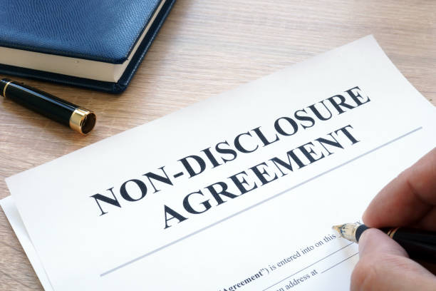 pice of paper with pen writing non disclosure agreement