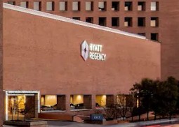 outside view of Hyatt Regency conference center with hotel name sign