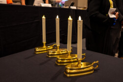 4 candles lit to memorialize NARFE members who died during the last year