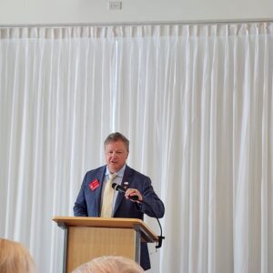 A picture of the Federation president at the podium.
