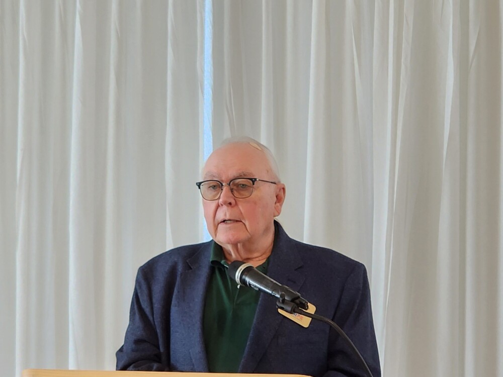 A picture of the regional VP at the podium.