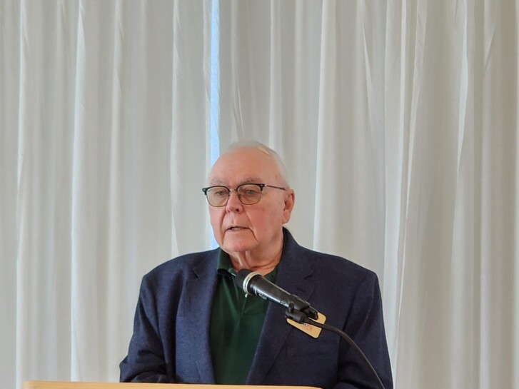 A picture of the regional VP at the podium.