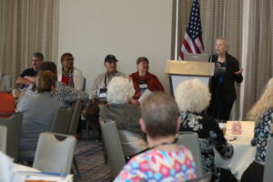 AMS Strategies for Success” panel at FEDcon24 was part of the NARFE Leadership Track. From left (seated): Daryl Zimmerman, South Dakota, Region V Configuration Advisory Board (CAB) Representative; Vernella Rogers, Louisiana, Region VI CAB Representative; Howard “Flash” Gordon, Maryland, Region II CAB Representative; Martha Raup, California, Region VIII CAB Representative and CAB Chair, and (standing) Dorothy Creswell, Texas, Former Region VI CAB Representative and Chair.