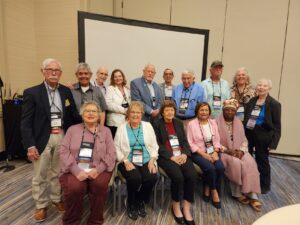 A picture of 15 Texas attendees at the FEDcon24 Region VI Caucus on August 19, 2024.