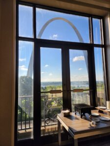 View of the St. Louis Arch seen through a window of the conference hotel.
