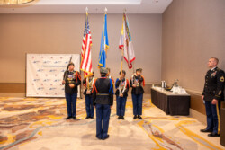 Harrisonburg Schools Honor Guard practicing before a presentiation with the U.S. Flag, the Commonwealth of Virginia Flag, and the Harrisonburg School Flag.