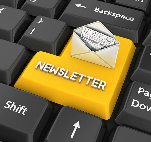 portion of a keyboard with a yellow key that says newsletter and an open envelope