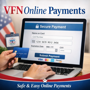 A computer screen taking an online payment with a hand and credit card