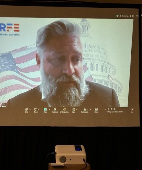 man projected on screen