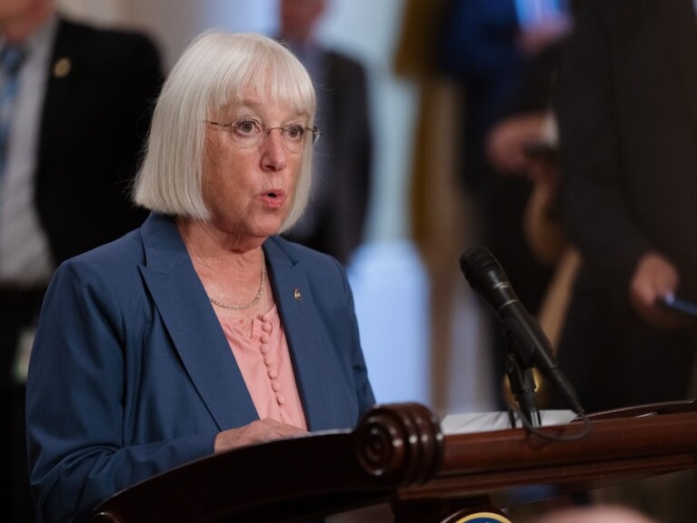 woman speaking at podium